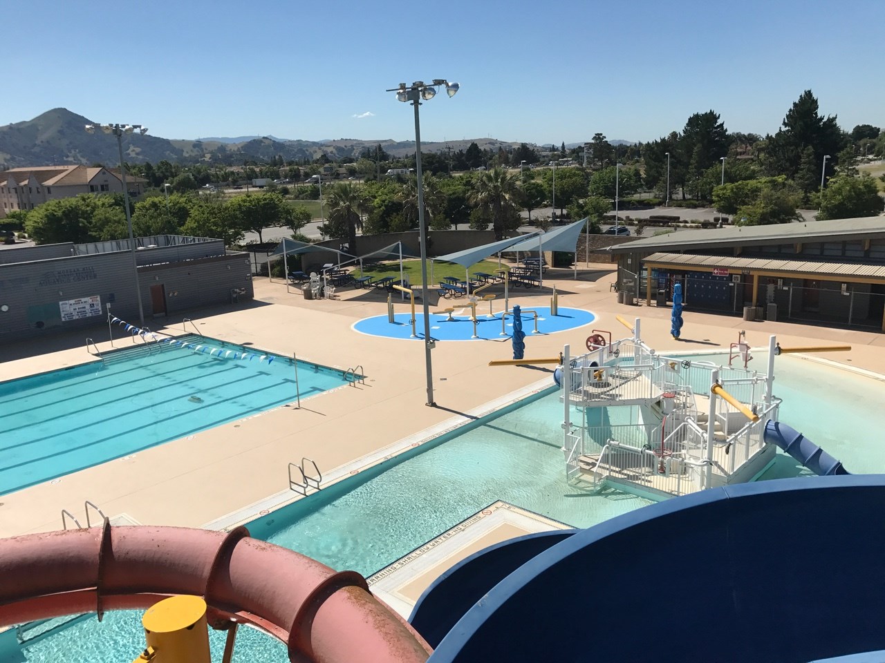 aerial view of splash pad surface near a pool